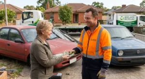 Adelaide cash for cars removalist handing cash to a car owner after a car removal quote